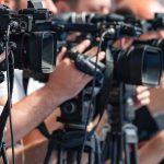 Army Grounds Apache Training After Deadly Texas Crash television cameras on tripods at a media event