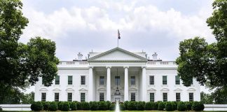 Trump Locks AI’s Biggest Names Into ONE Room The White House with fountain and red flower bed