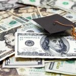 Why Seminary is Ditching Federal Loans Graduation cap on a pile of US dollar bills