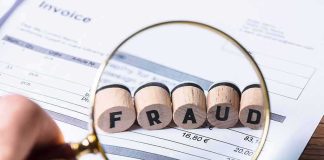 Taxpayer Tab: The Program Nobody Mentions Magnifying glass highlighting wooden blocks spelling fraud on an invoice