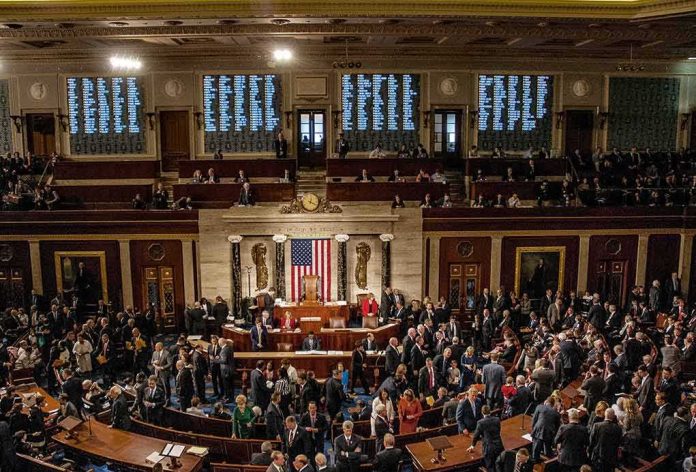 shutterstock_1186368280 U.S. House chamber with lawmakers gathered on the floor
