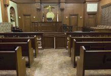 $100 Million Divorce Hits a Wall in Texas Interior view of an empty courtroom with wooden benches and a judges bench