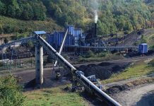 Steel Backbone SHATTERED – Ukraine’s Industry Goes Dark Coal processing plant with conveyor belts in a forested valley