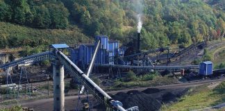 Coal processing plant with conveyor belts in a forested valley