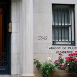 Embassy residence entrance with barred window and roses