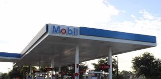 Mobil gas station with multiple pumps under a large canopy