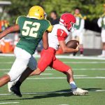 College Football Player Killed in Shocking Attack Football player in red runs with the ball as defender in green attempts a tackle