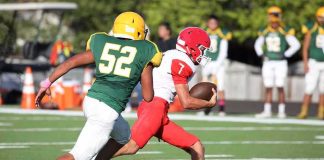 College Football Player Killed in Shocking Attack Football player in red runs with the ball as defender in green attempts a tackle
