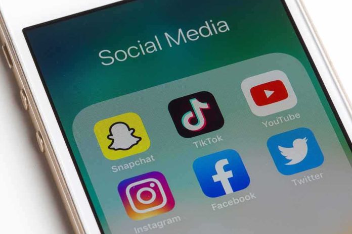 shutterstock_1551279269 Smartphone screen showing social media app icons