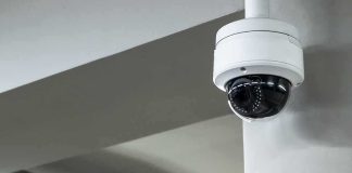 Dome security camera mounted on a ceiling corner