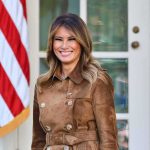 Melania Trump’s UN Power Play Stuns Tech Industry woman smiling in a brown suede coat