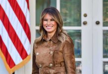 Melania Trump’s UN Power Play Stuns Tech Industry woman smiling in a brown suede coat