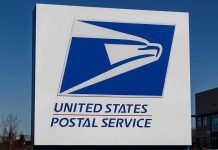 Why Federal Courts Are Split On Gun Bans At Post Offices USPS logo on an outdoor sign