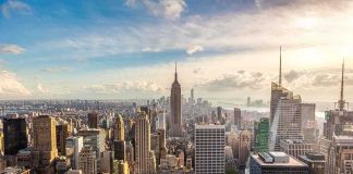 Aerial view of New York City skyline featuring the Empire State Building at sunset