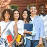 Illegal Immigrants Can Get California College GRANTS Group of students standing outside a campus building
