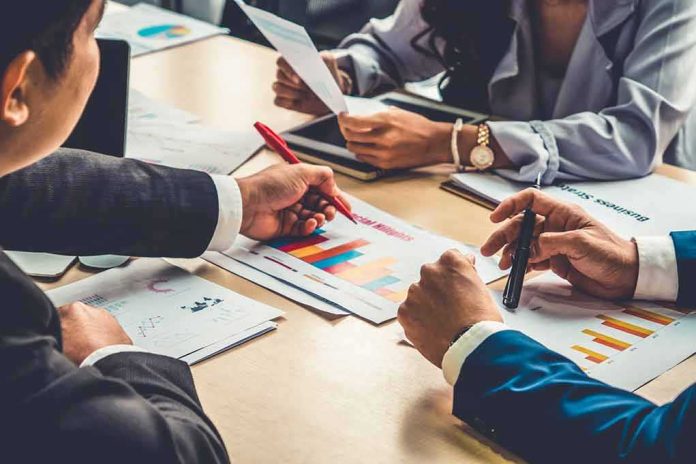 business team reviewing charts at a meeting table