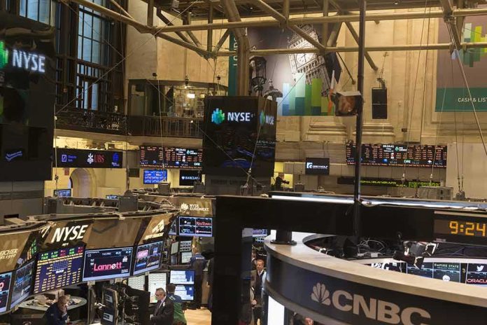 NYSE trading floor with monitors and tickers