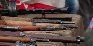 Vintage rifles displayed on a table