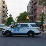 Brooklyn Horror: Woman Beaten To Death, Child Nearby NYPD police SUV blocking a city street at a taped-off scene
