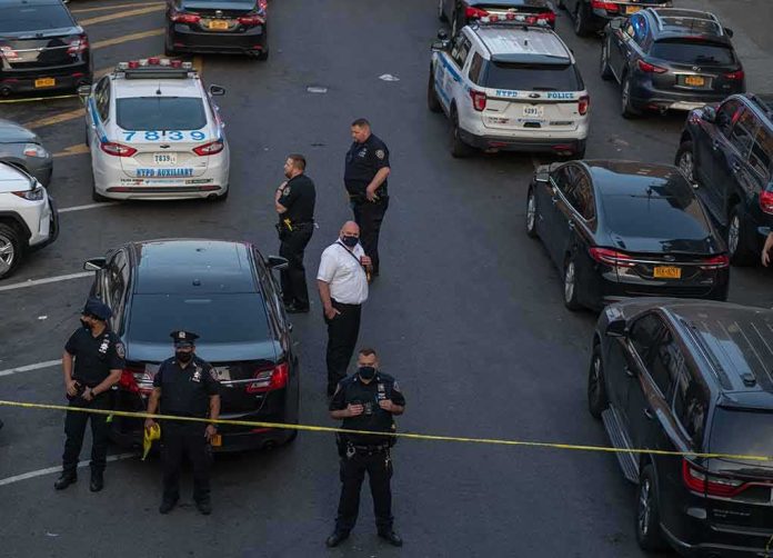 shutterstock_1976471639-1 Carlos Hyde and Brian Folkerts among police at taped-off street scene