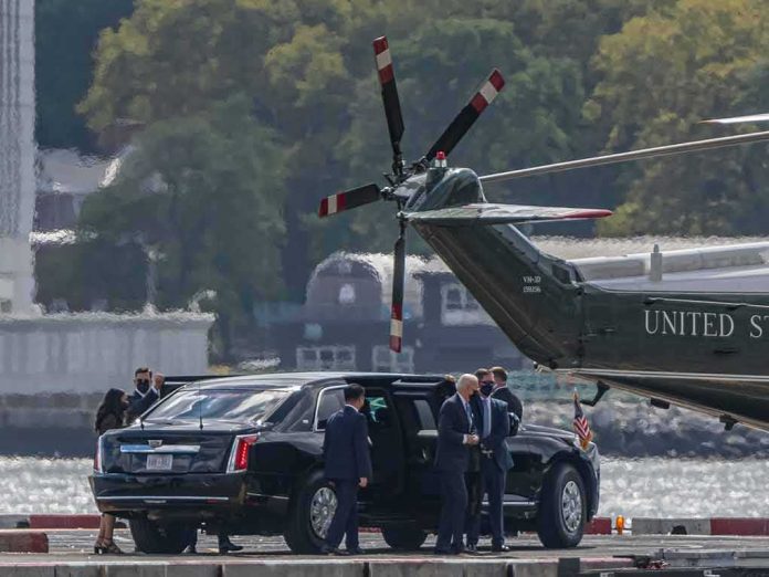 shutterstock_2045771600 Motorcade and helicopter on a waterfront helipad