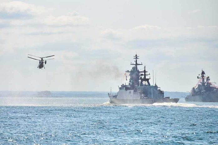military ships and helicopter at sea