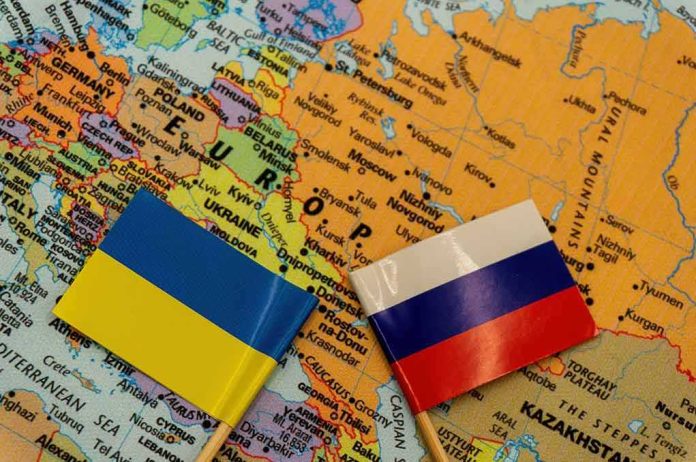 shutterstock_2109598166 Ukraine and Russia flags on a map of Eastern Europe