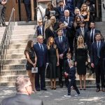 Ex CIA Man Had $40 Million in Gold in the Basement Mourners gather on church steps after a funeral service
