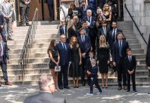 Ex CIA Man Had $40 Million in Gold in the Basement Mourners gather on church steps after a funeral service