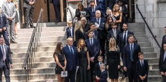 Ex CIA Man Had $40 Million in Gold in the Basement Mourners gather on church steps after a funeral service