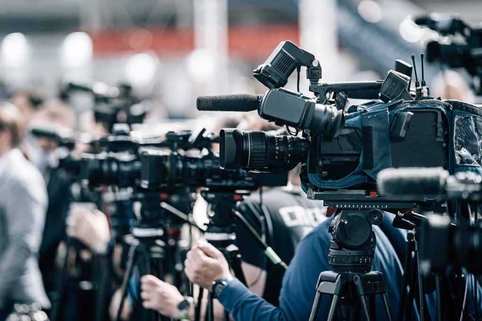 shutterstock_2197858977-5 Broadcast cameras on tripods at a press event