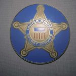 United States Secret Service badge emblem on blue background