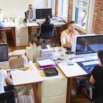 Open-plan office with employees working at desks