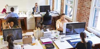 Open-plan office with employees working at desks