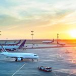 LaGuardia Tower Scandal: FRAUD, Not Crash Blame Airplanes on airport tarmac at sunset