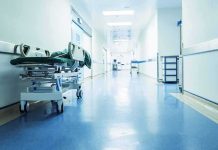 Hospital corridor with empty gurney