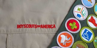 scout uniform with embroidered merit badges