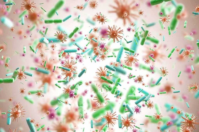 shutterstock_749207107-1 Colorful microscopic bacteria and viruses floating in space