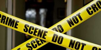 Actor PISTOL-WHIPPED by Armed Robbers Yellow crime scene tape crossing a doorway