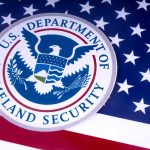 DHS Says New York Shielded Accused MURDERERS U.S. Department of Homeland Security seal on American flag