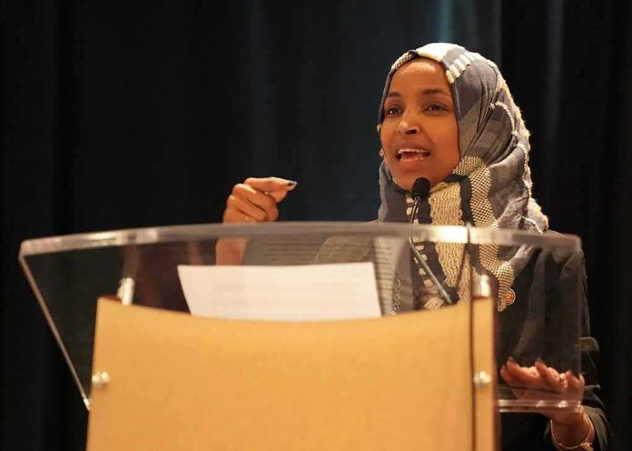 Ilhan Omar speaking at a podium with a microphone