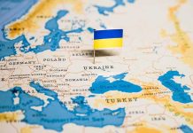 Ukraine flag pin on a map of Eastern Europe