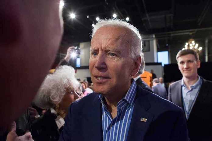 shutterstock_1390542488 Joe Biden greets people at an indoor event
