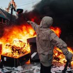 France May Send ARMY Into Its Own Streets Hooded person throws object near street fire