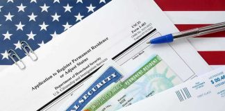 immigration forms with green card and social security card on US flag background