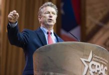 Rand Paul Blocks KOSA Fast-Track Attempt Man in suit speaking at a podium with a microphone