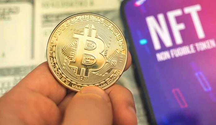 shutterstock_1979214503 Bitcoin coin held next to a smartphone displaying NFT screen