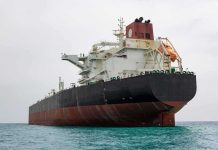 Iran Claims TOTAL Control of Key Oil Route Large oil tanker anchored in calm sea