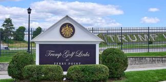 Trump Wants a New ‘Camp David’ Entrance sign at a golf course with manicured shrubs