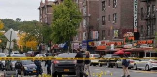 15-Year-Old CHARGED in Homecoming Mass Shooting Police investigate a taped-off urban street crime scene